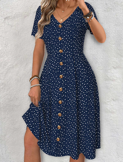 Abito blu marino con maniche corte, scollo a V e motivo a pois