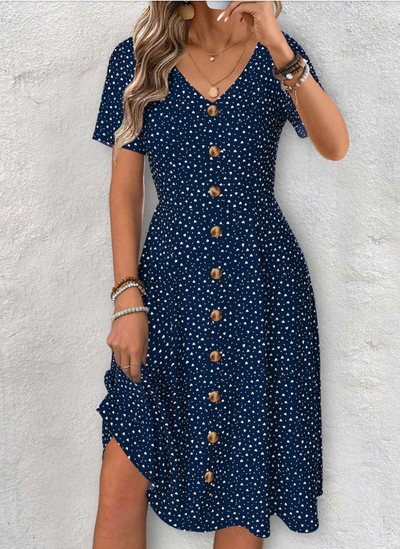 Abito blu marino con maniche corte, scollo a V e motivo a pois